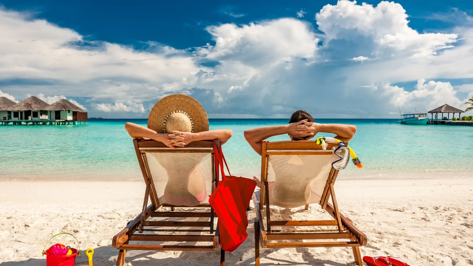 Close-up of a person using a laptop to compare travel insurance quotes on the Paying Too Much website